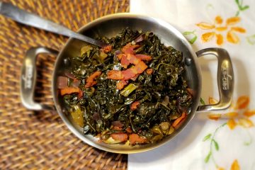 A bowl of Easy 5-Ingredient Sweet and Sour Greens is topped with crunchy bits of bacon.