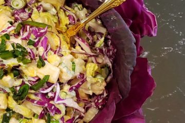 Red Cabbage leaves line a generous bowl of this beautiful Easy 30 Minute Roasted Chilies and Pineapple Slaw. Crisp Napa cabbage, roasted chilies, pineapple and jalapenos make this slightly sweet, perfectly spicy salad a delicious variation on a theme.