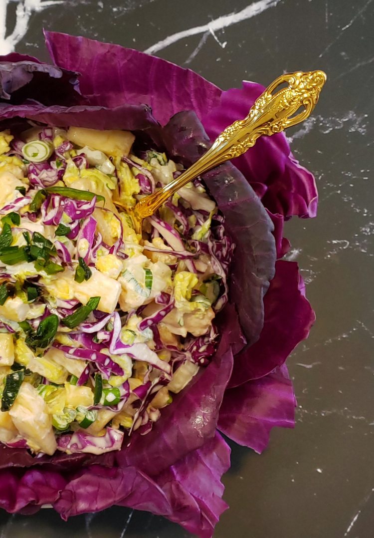 Red Cabbage leaves line a generous bowl of this beautiful Easy 30 Minute Roasted Chilies and Pineapple Slaw. Crisp Napa cabbage, roasted chilies, pineapple and jalapenos make this slightly sweet, perfectly spicy salad a delicious variation on a theme.