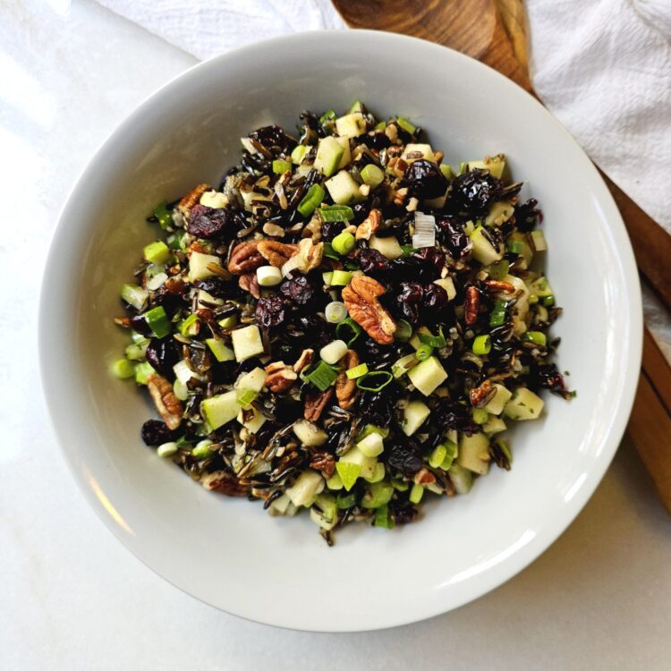a close-up of the ingredients in this wild rice harvest salad