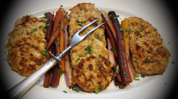 A serving platter of these Delicious Rosé Chicken Breakfast Sausages in 45 Minutes is prominently featured at a brunch buffet.