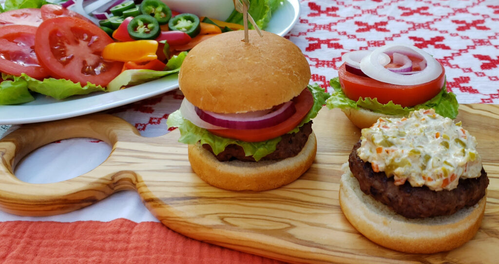 A burger bun is generously covered with the Best 3-Ingredient Olive Sauce in Michigan.