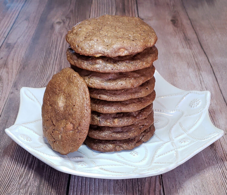 A tall stack of Easy 4 Chocolates Lime Cookies stands ready on a simple white plate.