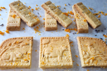 Lined up like soldiers, these Easy 7-Ingredient Orange Lavender Shortbread cookies have orange zest and dried lavender blossoms in each bite.