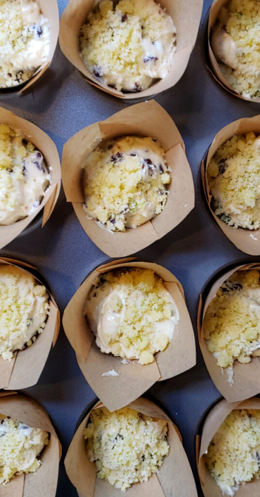 A tray of Authentic Montmorency Cherry Lime Streusel Muffins stands ready to go into the oven.