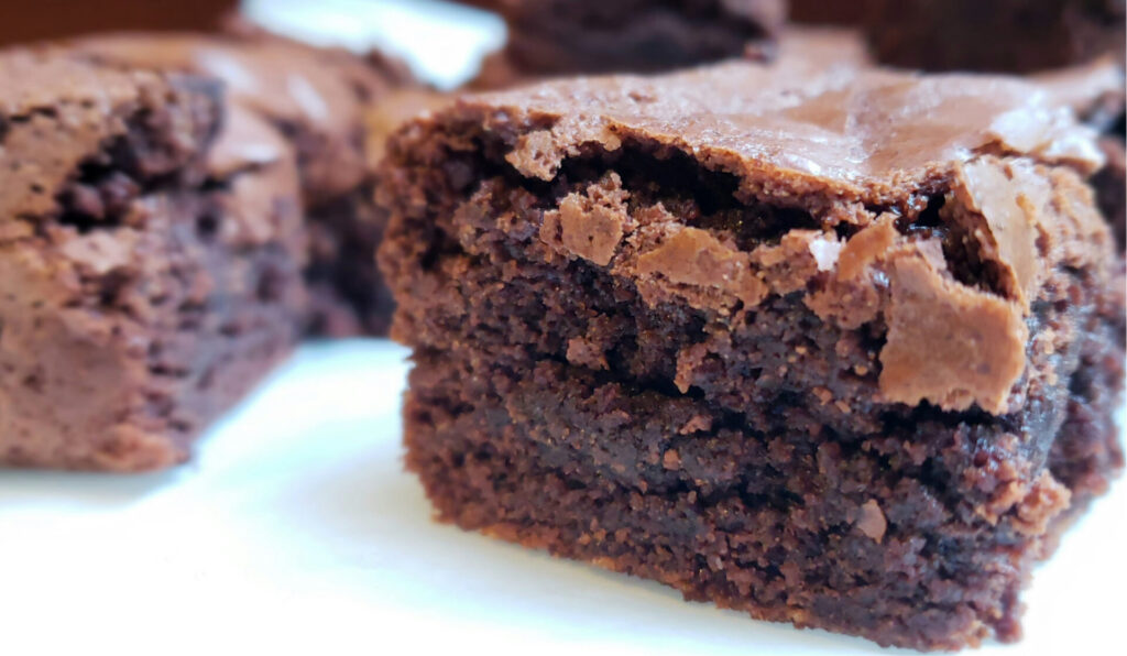 A closeup shot of an Easy gluten free - GF Brown Butter Brownie. A perfect balance between fudge-like and cakey, rich and chocolately.