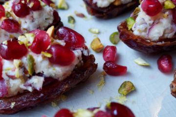 Medjool dates are topped with mascarpone cheese, pancetta, fresh cranberries, pomegranate arils, chestnuts and pistachios in these Delicious 2 Bite Jeweled Stuffed Dates. A little sweet. A little salty and bursting with flavor.