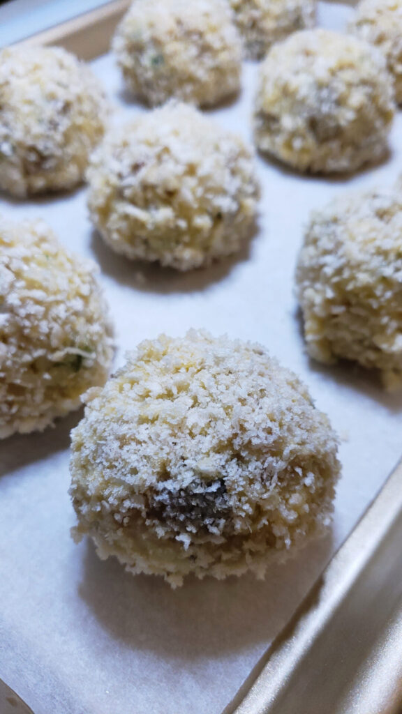 A batch of Easy Mushroom Arancini in 2 Hours are rolled and ready to fry.