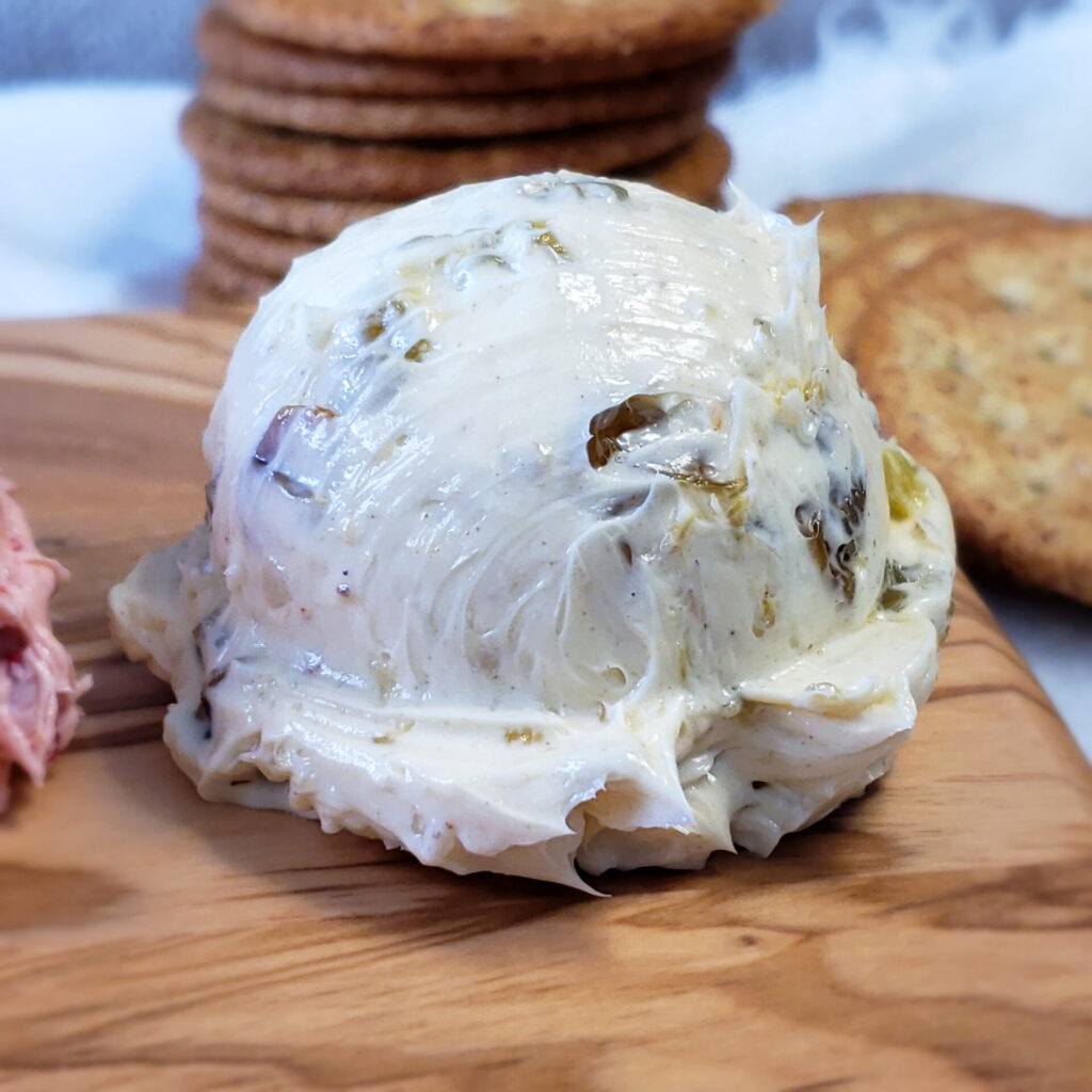 A scoop of the Rum Raisin version of this recipe for Easy Sweet and Savory Compound Butter 4 Ways reveals golden raisins soaked in spiced rum and sweetened with a hint of honey and cinnamon. The texture is light and airy like a good buttercream. 