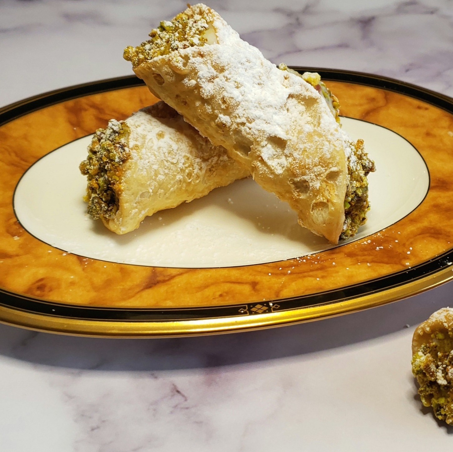 Happy first Monday of the New Year!  I thought I'd go all in this week and share two interwoven recipes back-to-back. 

Every year, I make our family’s recipe for both cannoli shells and the custard that fills them for the holidays – family events, office parties, and gatherings with friends – and every year I have someone ask me for the recipe or say that they searched for it on the blog, but couldn’t find it.

Typically, the recipes you find here on the MOstly Bakes blog are my own original recipes, with the exception of a few from either side of the family that have been re-engineered for today’s home cooks. Like those recipes, this one is not mine from a purely creative perspective. I didn’t develop it, but it is definitely a part of me, my holiday baking traditions, and my identity as a home cook.

This past Christmas, once more I had someone ask for the recipe, and again I explained that it couldn’t be found on the blog because it hadn’t been shared in that space. It was then that I realized that regardless of their origin story, all good recipes are meant to be shared.

Giving credit where credit is due, I’m grateful to the women on my mother’s side of the family who developed this recipe and passed it down through generations. I wish I could have been a quiet observer in their kitchens. I can’t tell their story because I wasn’t there to bear witness, but I can share with you my family’s recipes for custard filling and cannoli shells as they were shared with me.

Recipe available on the blog 👇👇👇
https://mostlybakes.com/authentic-sicilian-cannoli-custard-filling/ 

#cannoli #italiandesserts #holidaybaking #familyrecipes #foodblogger