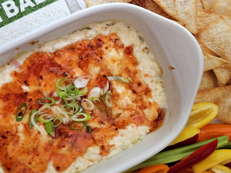 A tray of fresh cut veggies and crispy wonton chips are served next to a dish of irresistible rangoon dip in 30 minutes.