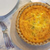 A closeup bite of this Easy 5 Star Homemade Quiche in 90 Minutes reveals ham, leeks and Gouda cheese.