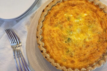 A closeup bite of this Easy 5 Star Homemade Quiche in 90 Minutes reveals ham, leeks and Gouda cheese.
