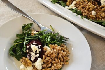 Farro, feta, toasted walnuts and pickled beets over a bed of Arugula are lightly dressed in honey shallot dressing in this Easy Pickled Beets Salad.