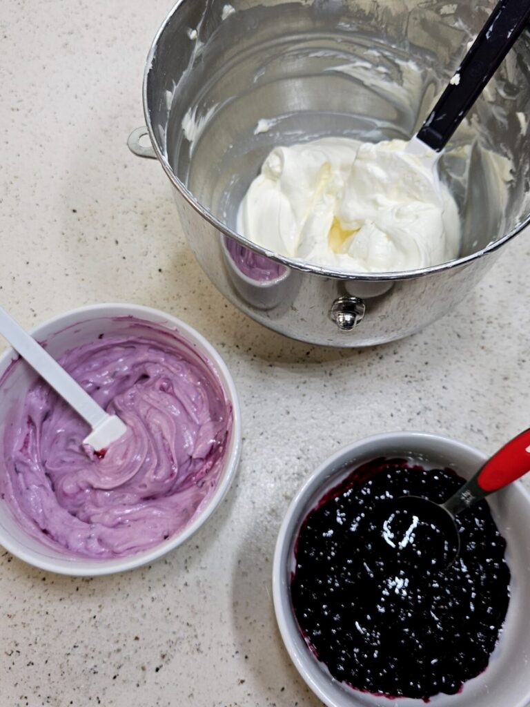 The ingredients for assembling this no bake cheesecake are shown. Swirls of homemade blueberry jam in a lime cheesecake filling and graham cracker crumb crust make up this irresistible Blueberry Lime No Bake Cheesecake.