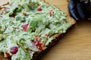 a piece of toast with avocado sandwich spread on it