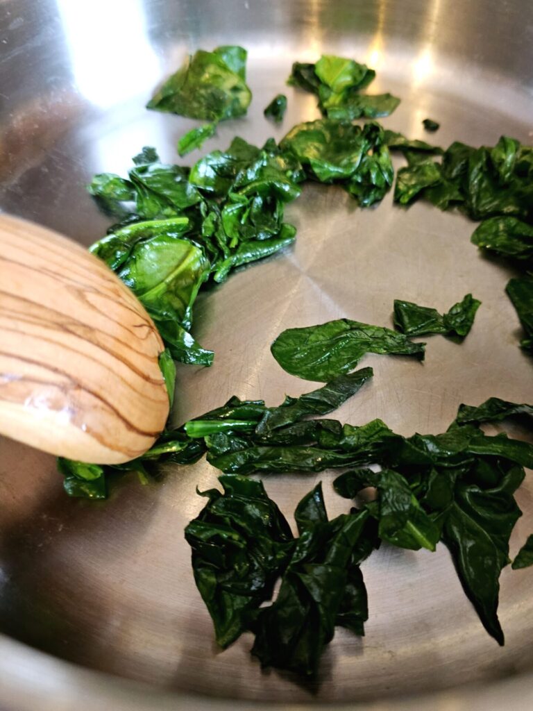 A picture of cooked spinach used in this recipe for Easy Chipotle Chicken Dip in 15 Minutes