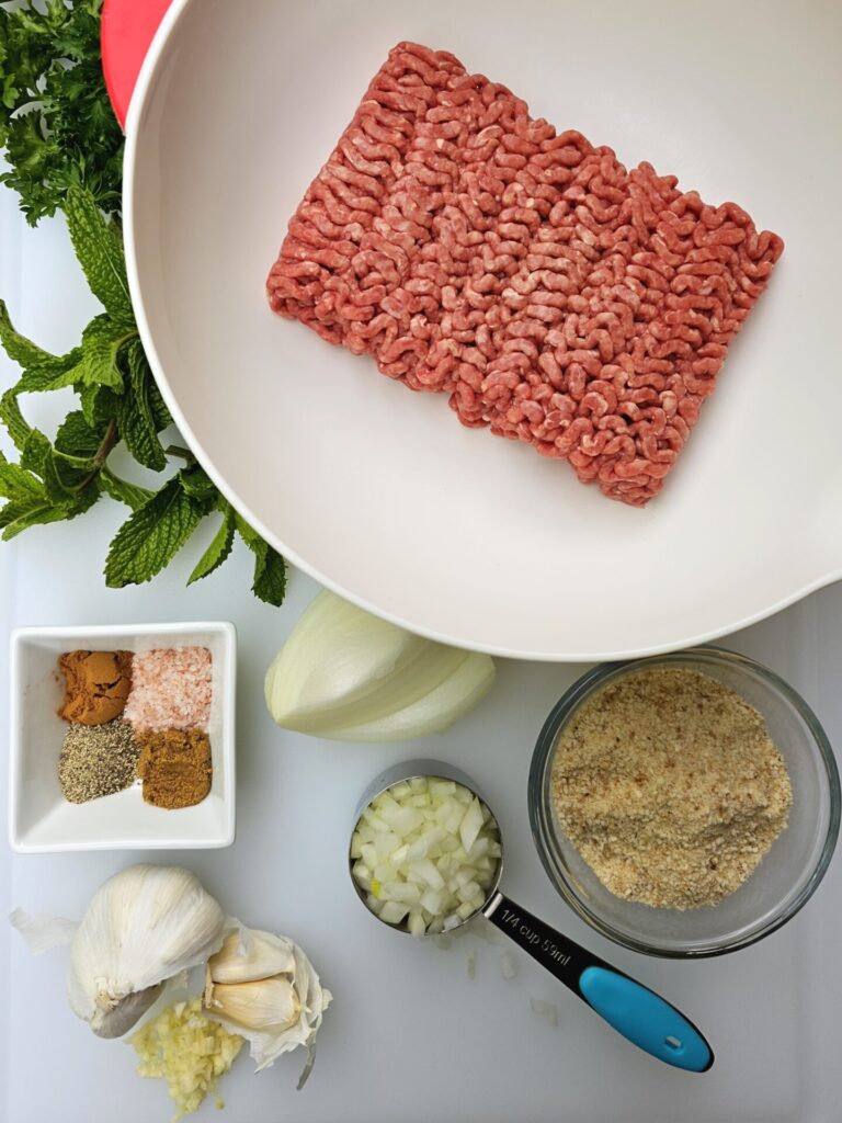 A tray with all the ingredients needed to make this recipe for Irresistible 30-Minute Lebanese Kafta with 7 Must-Try Sides