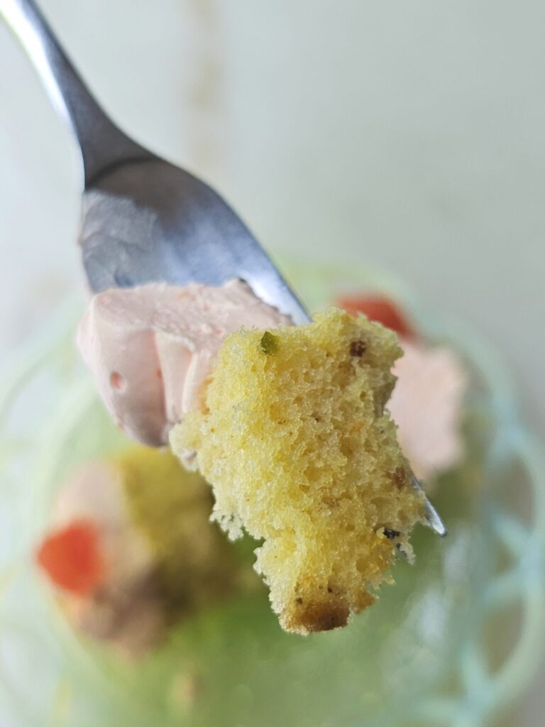 A closeup of a bite of these Bright and Zesty Pistachio and Grapefruit Cupcakes. 