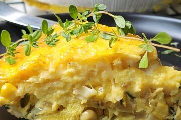 A slice of this Easy Grilled Corn Quiche sits on a plate.