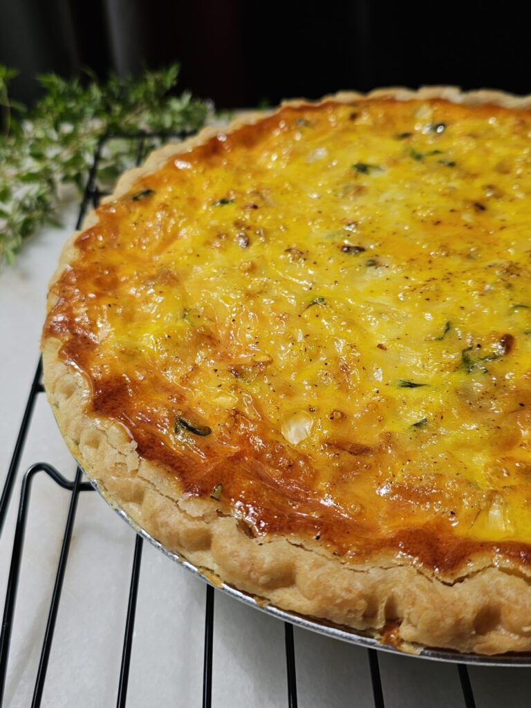 A picture of this Easy Grilled Corn Quiche is cooling on a rack.