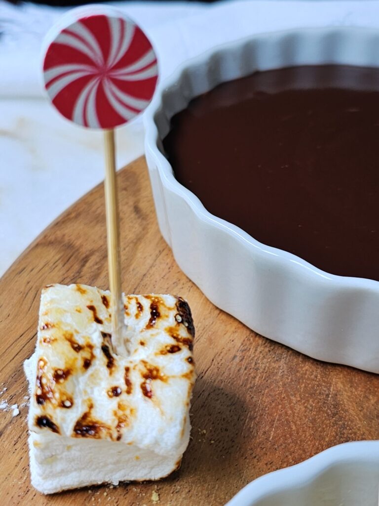 Citrus and Cracked Pepper Marshmallows Rest on a dessert board.