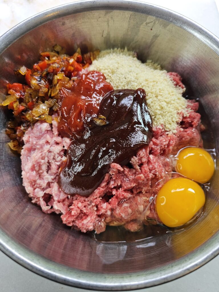 All the ingredients for this Easy Meatloaf Recipe are pictured in a bowl and ready to be mixed.
