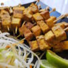 A plate of these Easy Coconut Curry Tofu 2 Ways sits ready to eat.