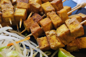 A plate of these Easy Coconut Curry Tofu 2 Ways sits ready to eat.