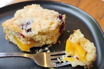 Peaches and blackberries in every bite of a plated square of this Blackberry Peach Coffee Cake.