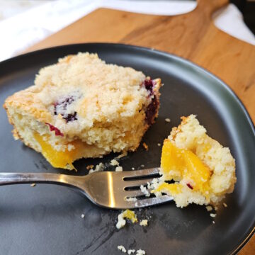 Peaches and blackberries in every bite of a plated square of this Blackberry Peach Coffee Cake.