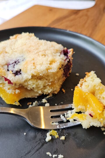 Peaches and blackberries in every bite of a plated square of this Blackberry Peach Coffee Cake.