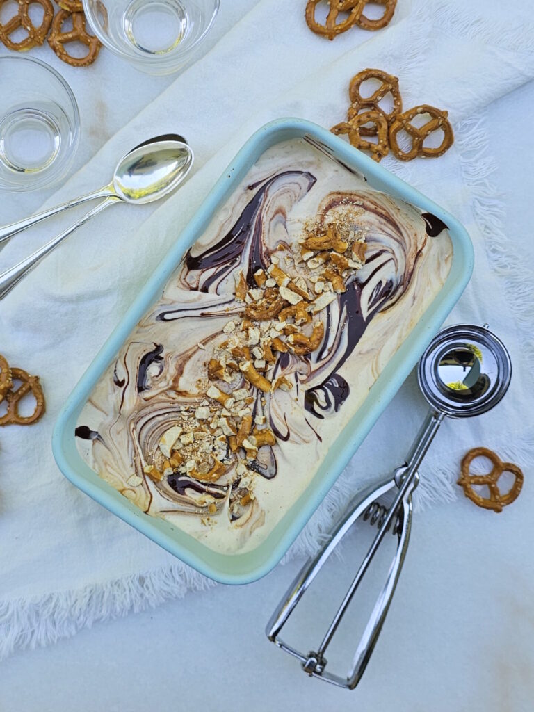 A chilled tray of Peanut Butter Ice Cream is ready to be scooped into cups.